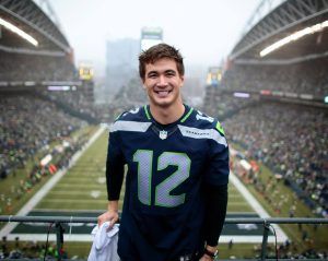 Nathan Adrian Raises 12th Man Flag at Seahawks Game